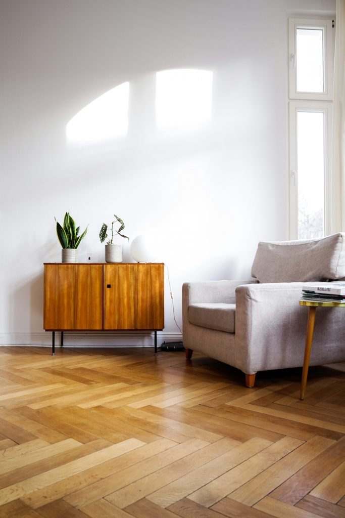 Minimalist living room with a wooden sideboard and clutter-free styling