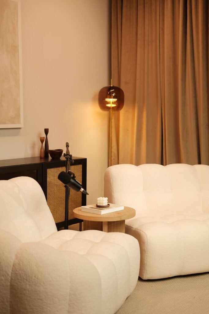 Elegant neutral living room with bouclé seating and warm layered decor